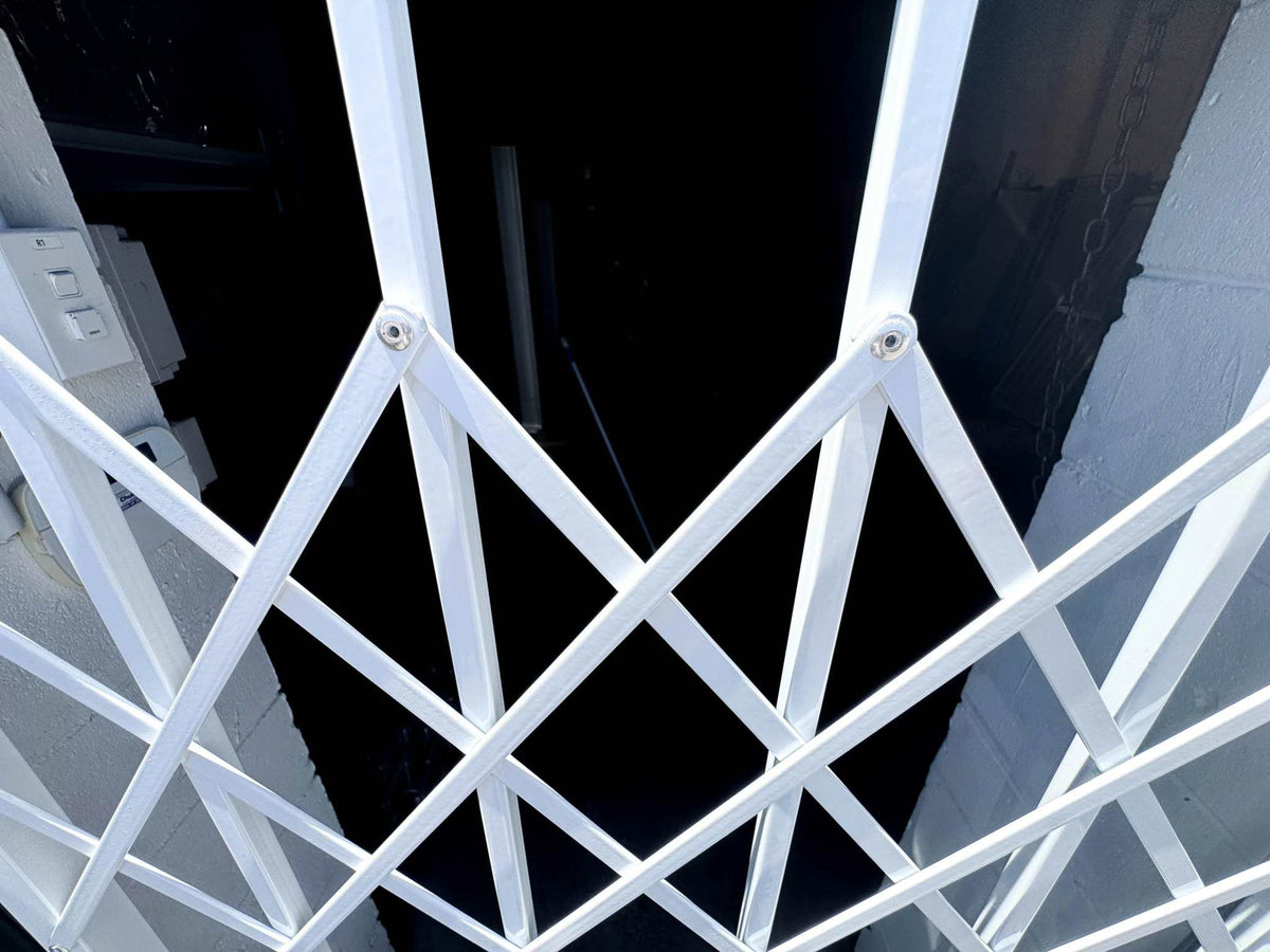 Trellis style steel security gate with decorative design for residential entrances