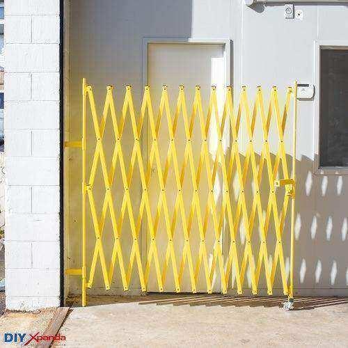 Yellow expandable barrier with adjustable scissor gate design for pedestrian access control