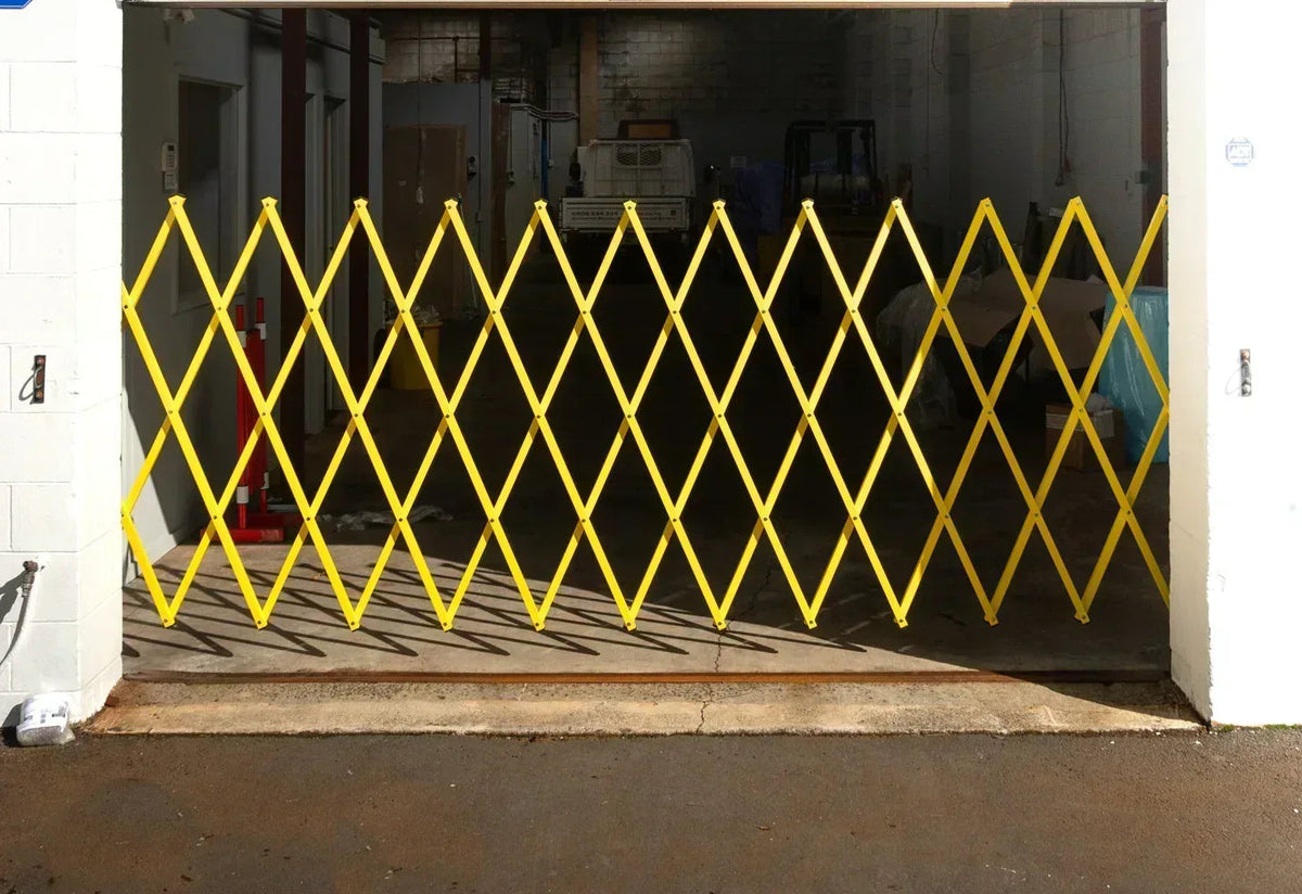 Yellow expandable barrier adjustable scissor gate barrier available for Pedestrian Barrier Rental as well