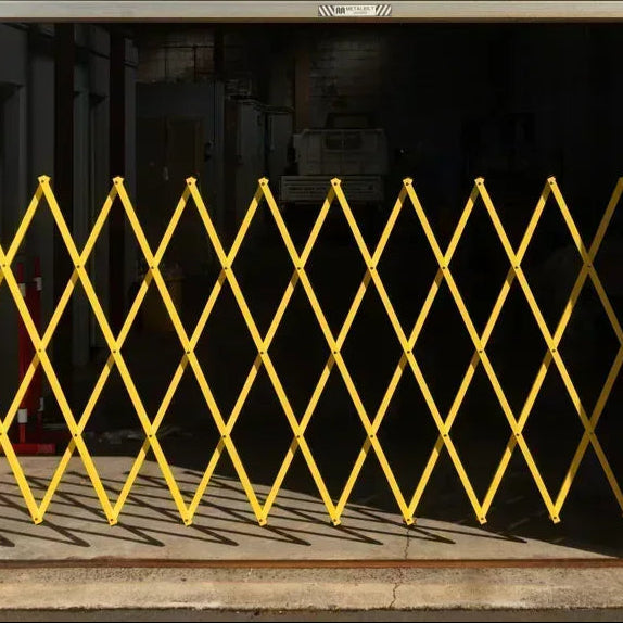 Yellow expandable barrier adjustable scissor gate barrier available for Pedestrian Barrier Rental as well