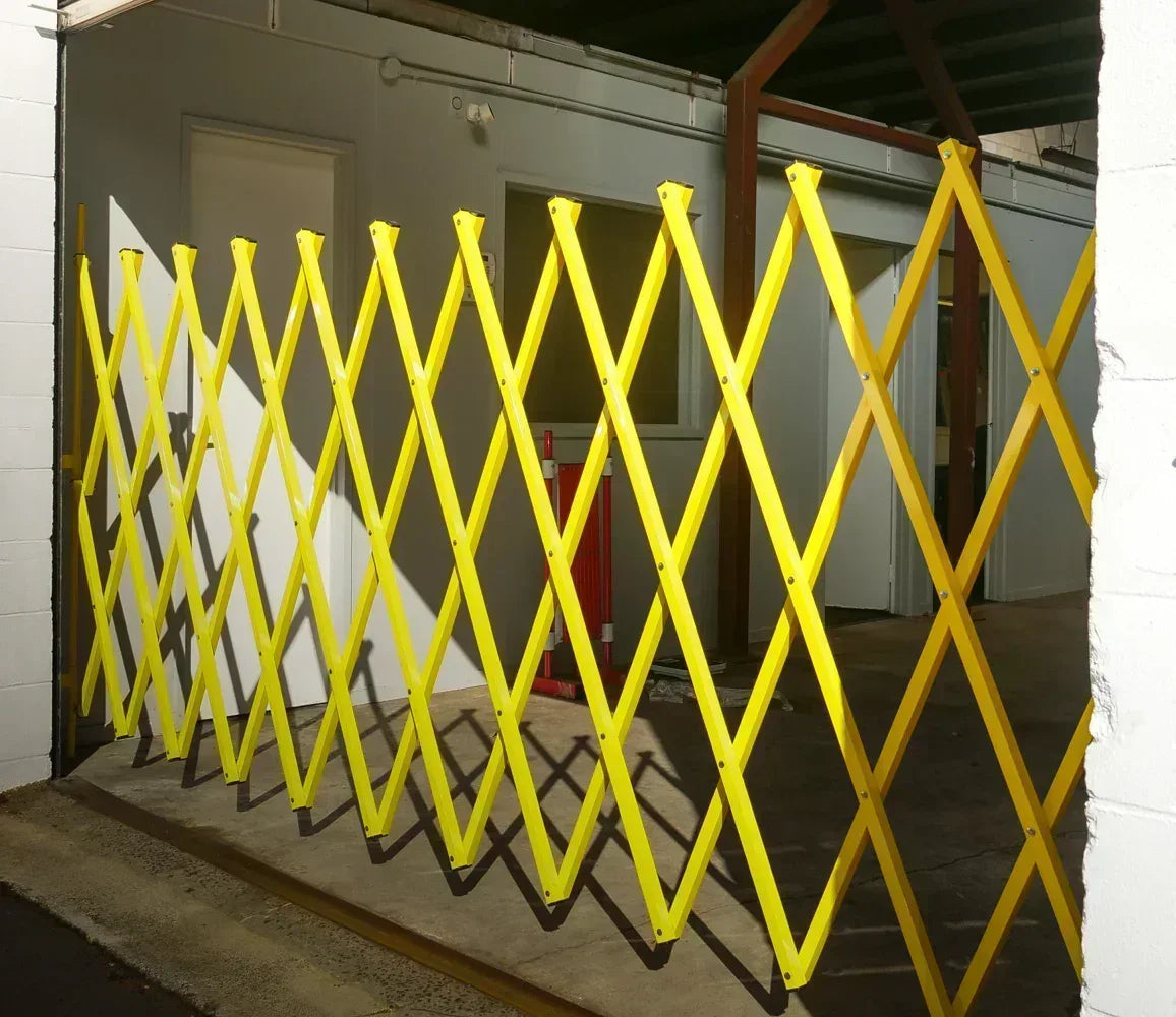 Yellow expandable barrier adjustable scissor gate barrier available for Pedestrian Barrier Rental as well