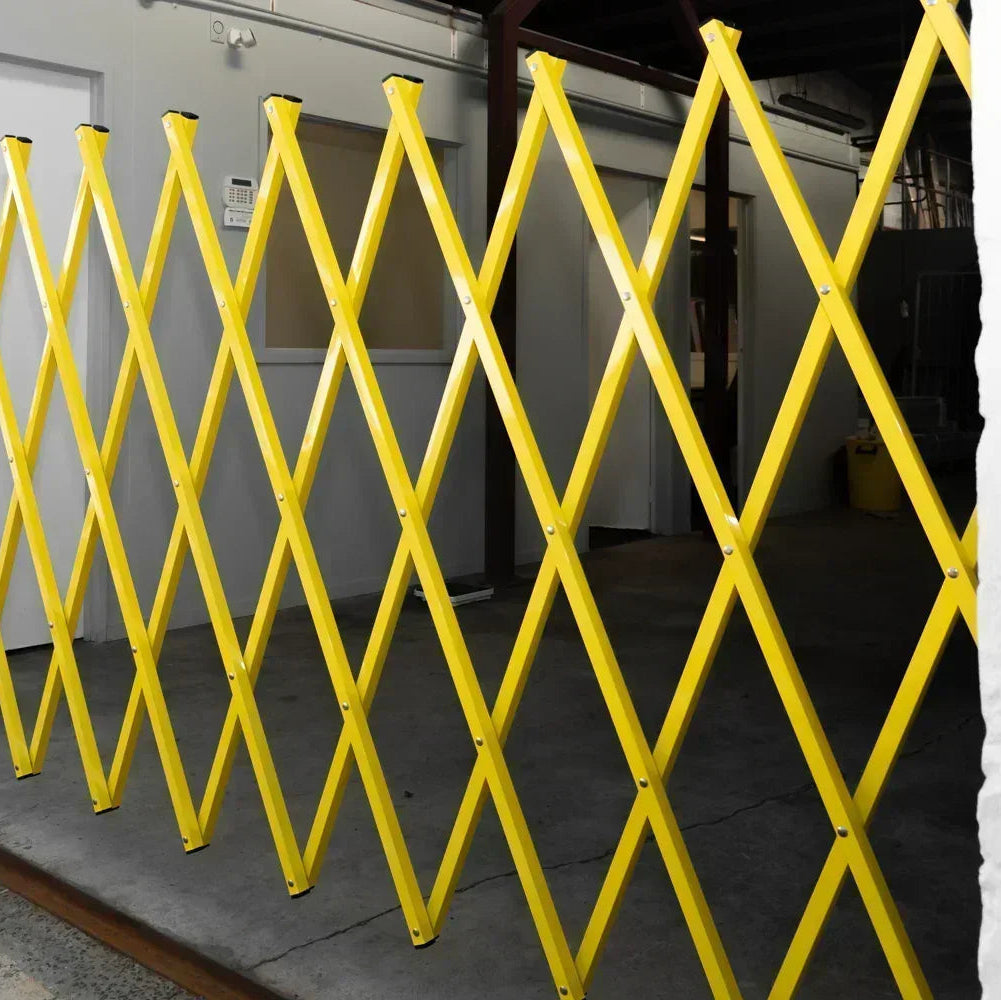 Yellow expandable barrier adjustable scissor gate barrier available for Pedestrian Barrier Rental as well
