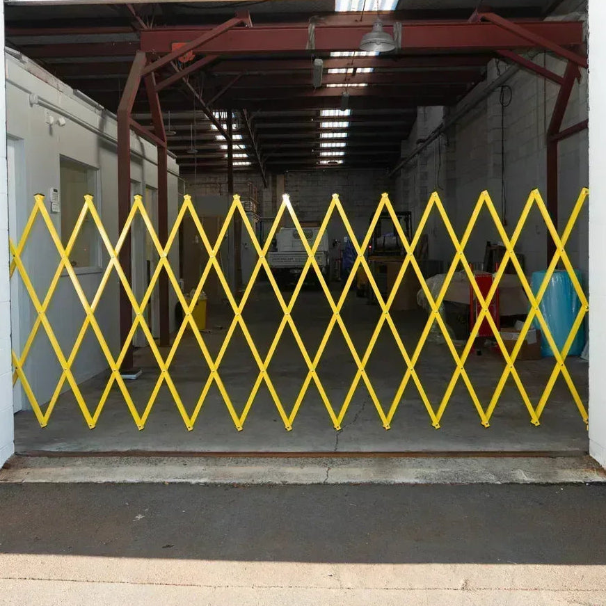 Yellow expandable barrier adjustable scissor gate barrier available for Pedestrian Barrier Rental as well