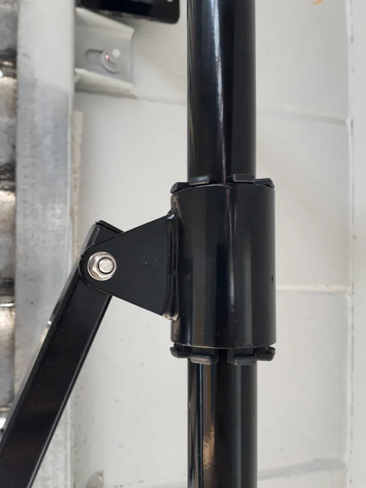 Black expandable barrier with adjustable scissor gate design for access control and safety management