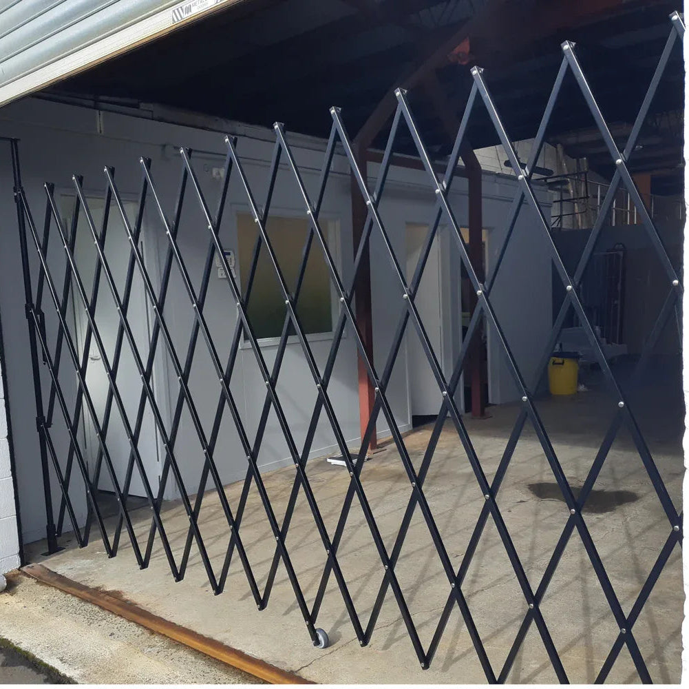 Black expandable barrier with adjustable scissor gate design for access control and safety management