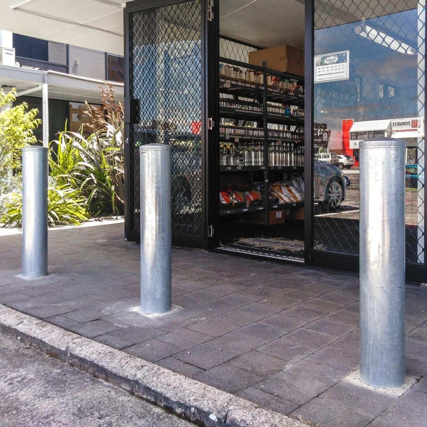 Removable bollards pipe and base set installed in residential driveway