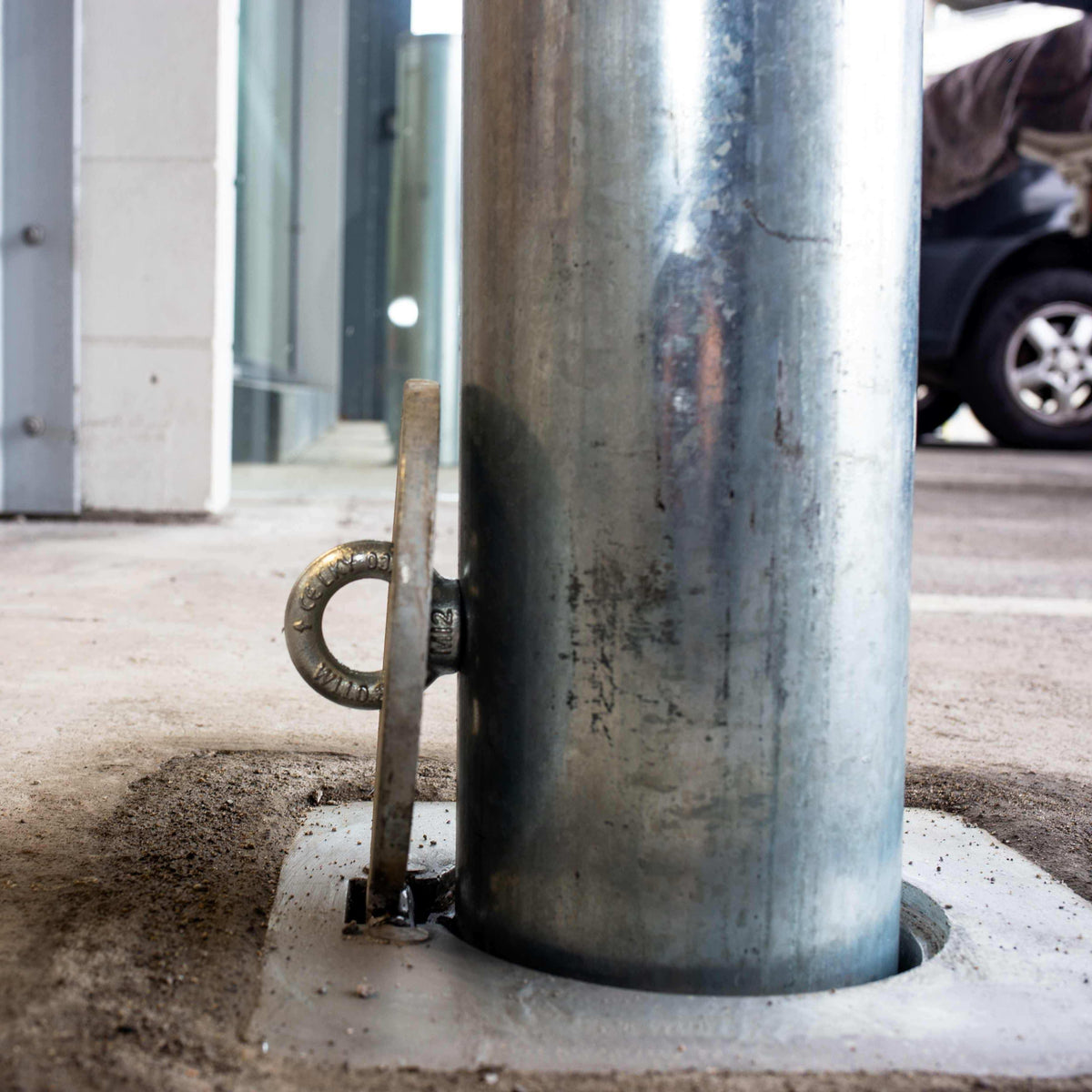 Removable bollards pipe and base set installed in residential driveway