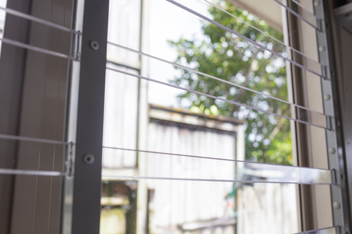 Clear Guard transparent window protection installed on residential window