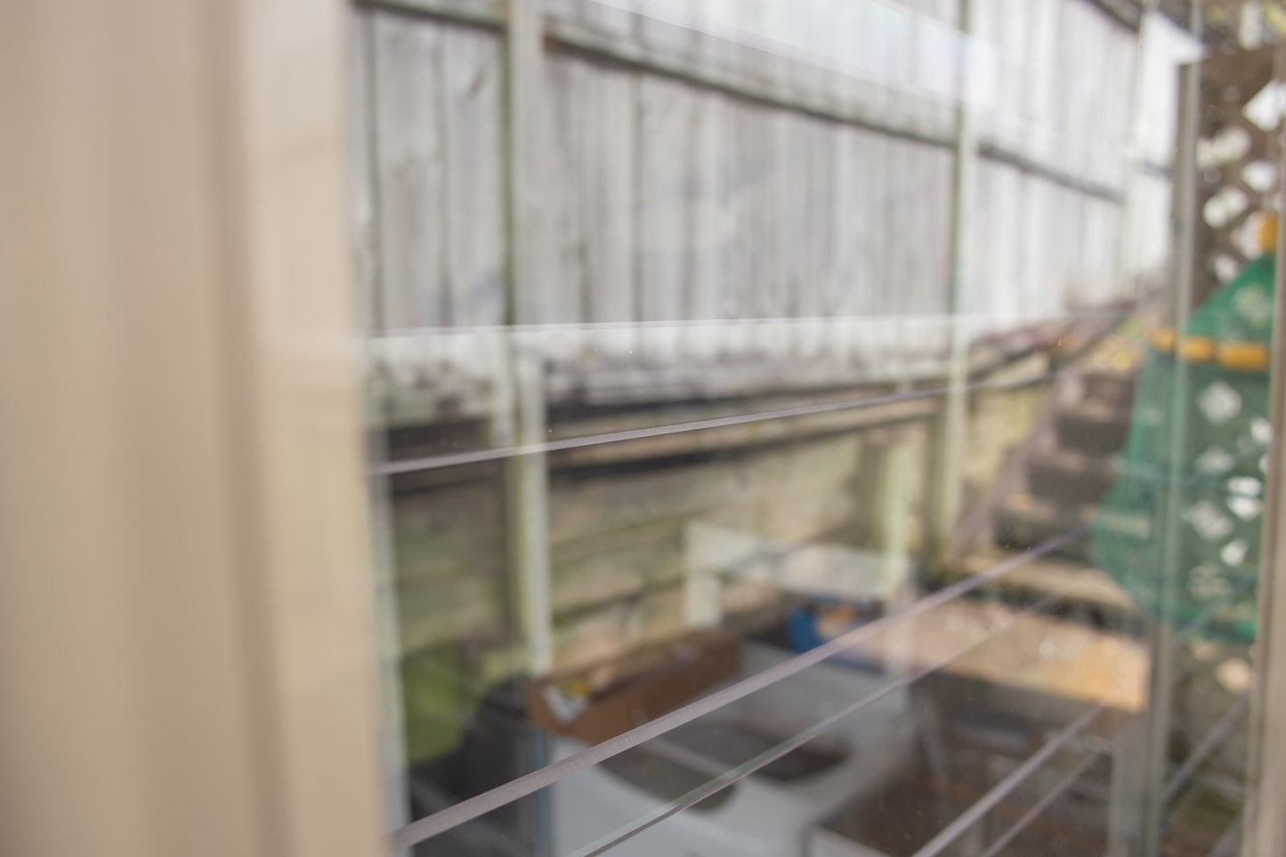 Clear Guard transparent window protection installed on residential window