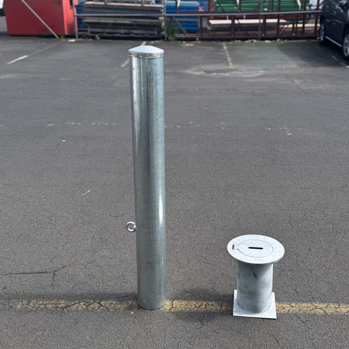 Removable bollards pipe and base set installed in residential driveway