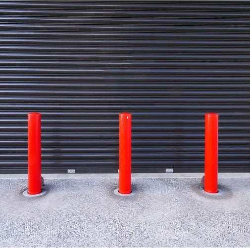 Removable bollards pipe and base set installed in residential driveway