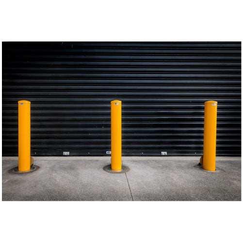Removable bollards pipe and base set installed in residential driveway