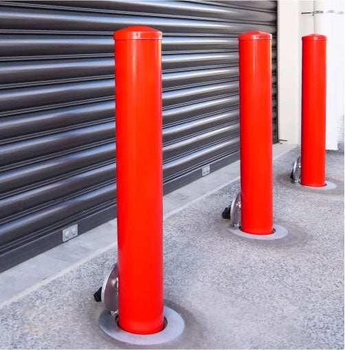 Removable bollards pipe and base set installed in residential driveway