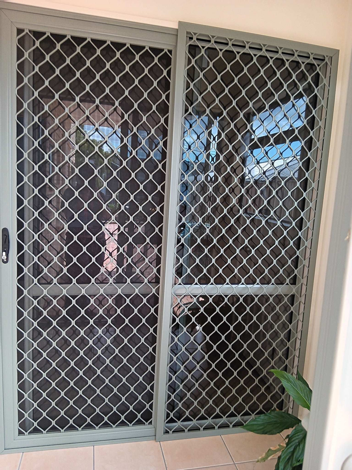 Amplimesh security screen installed on residential doorway