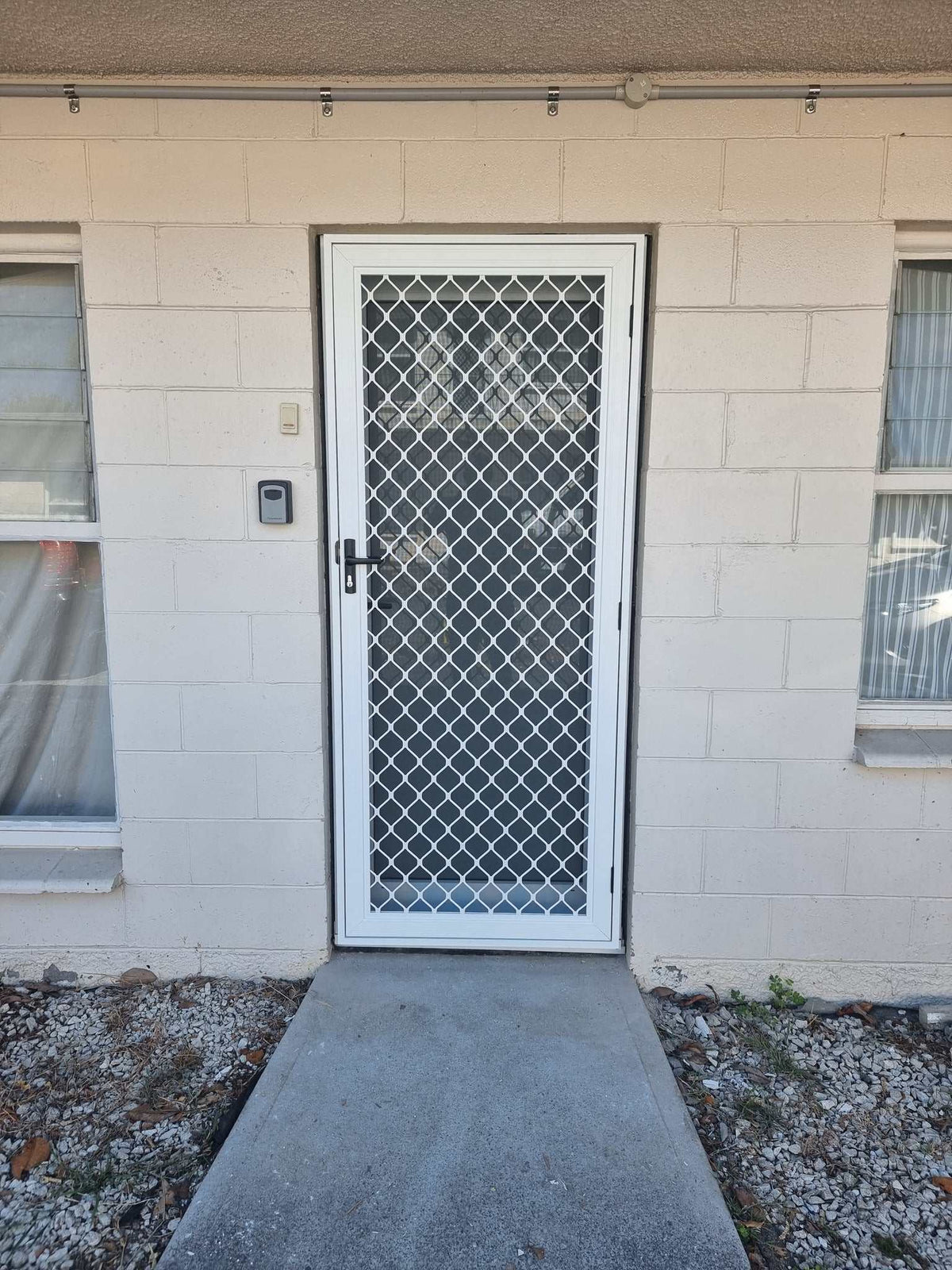 Amplimesh security screen installed on residential doorway