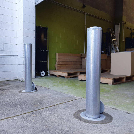 Removable bollards pipe and base set installed in residential driveway