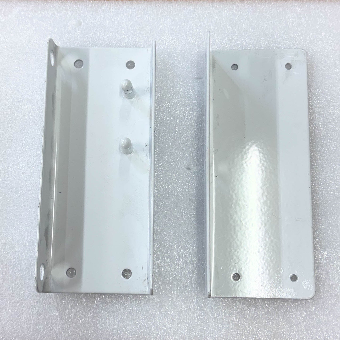 Hinges of the Saftidor retractable security grille installed on residential doorway