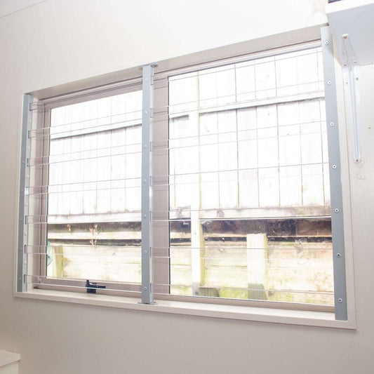 Clear Guard transparent window protection installed on residential window
