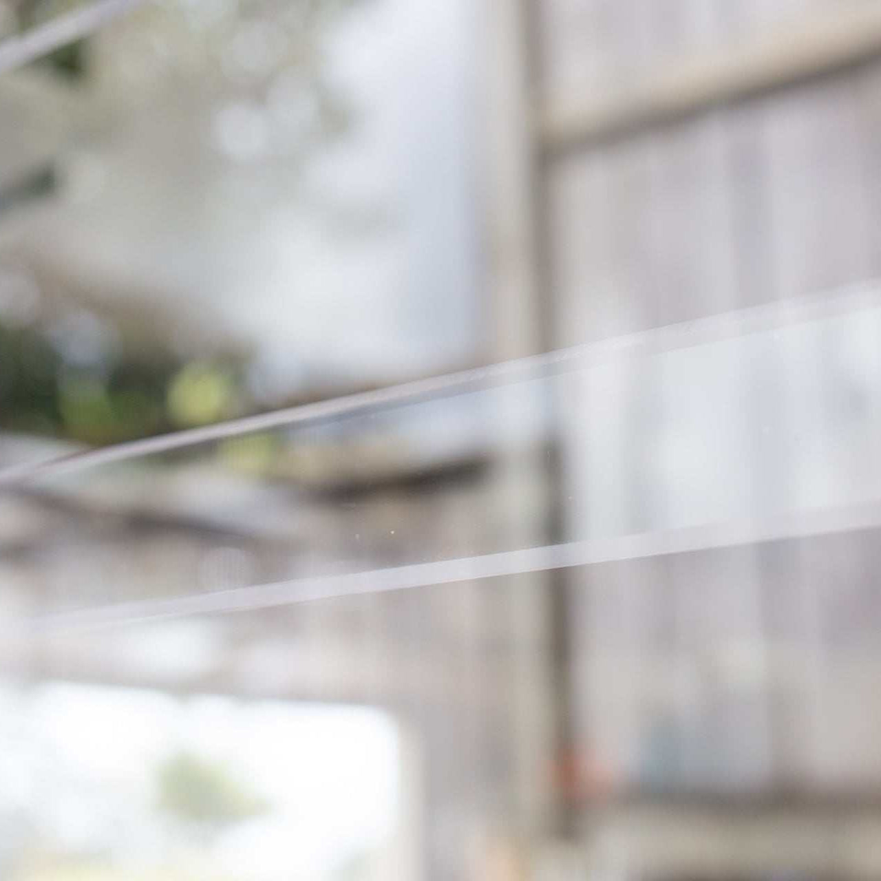 Clear Guard transparent window protection installed on residential window