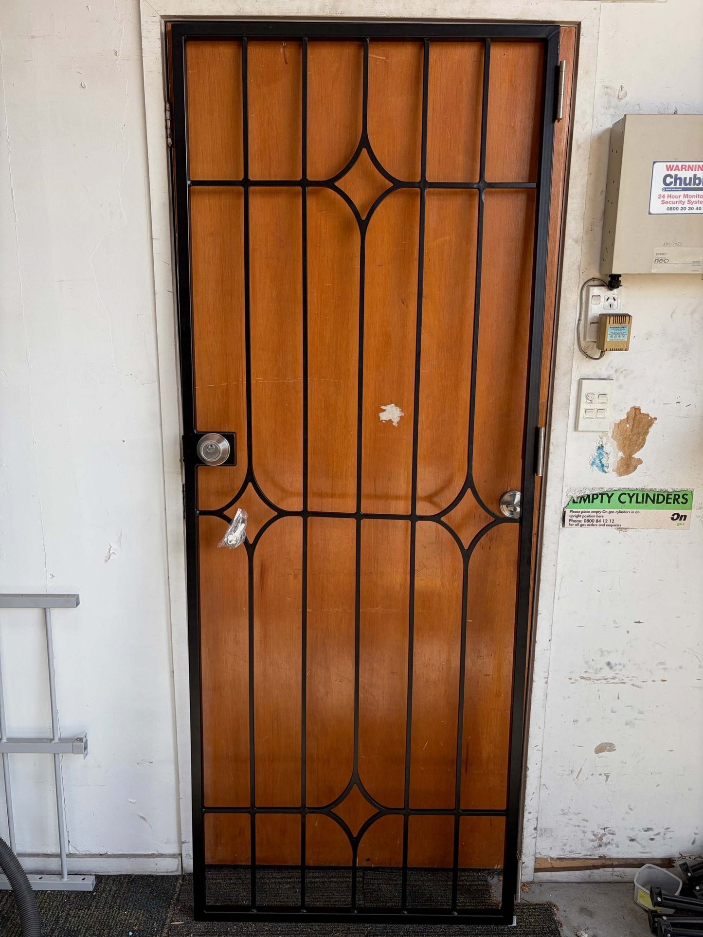 Fixed swing security gate with decorative centre design