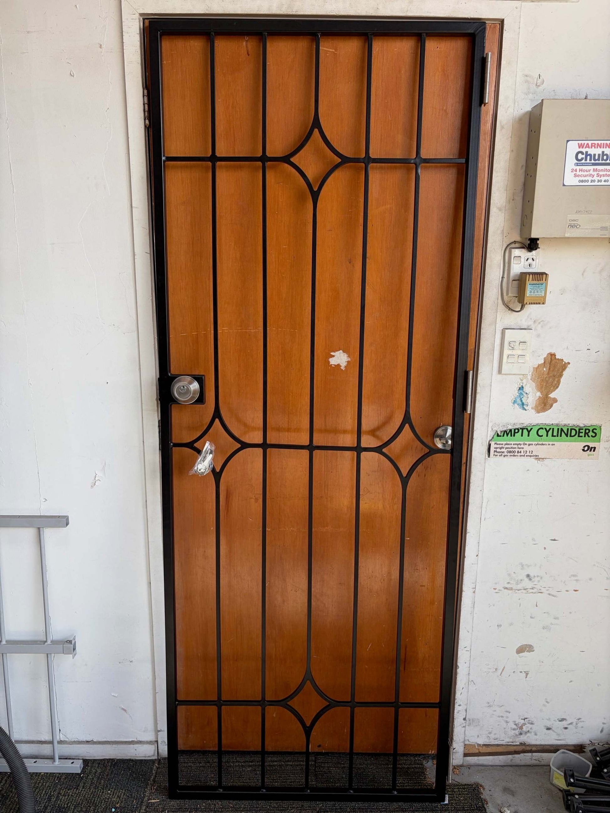 Fixed swing security gate with decorative centre design