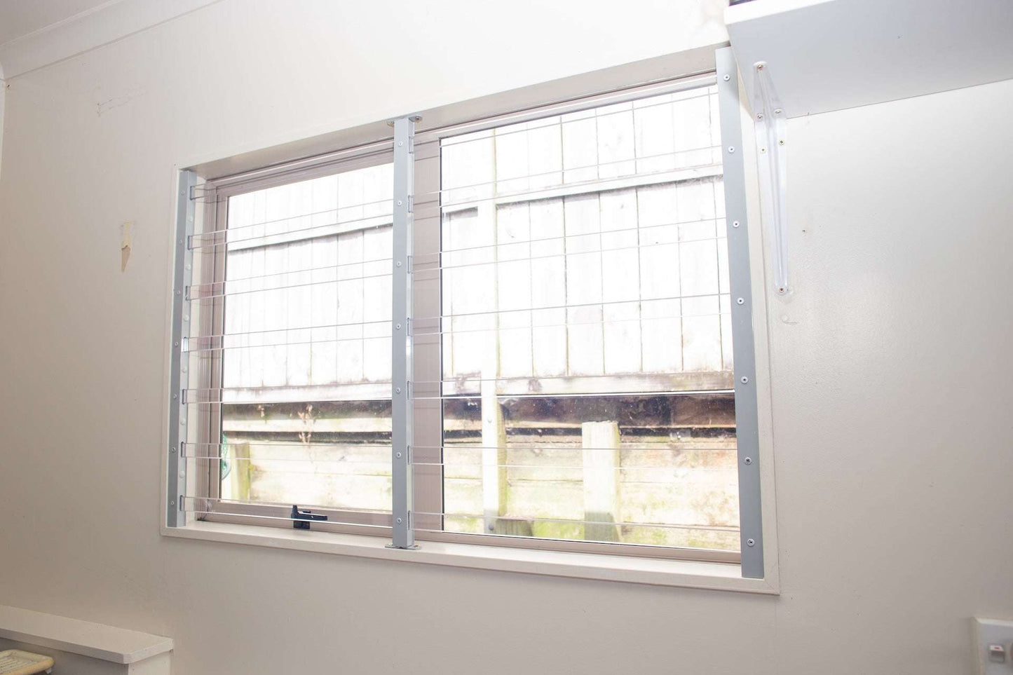Clear Guard transparent window protection installed on residential window