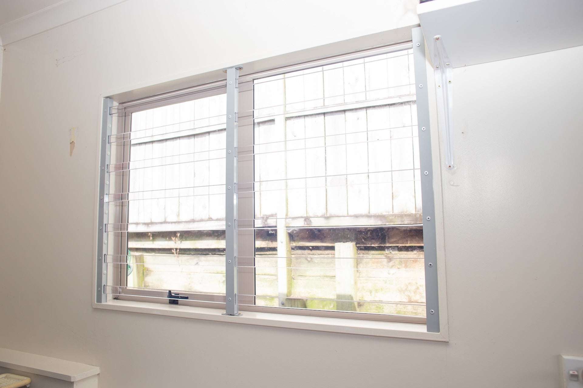 Clear Guard transparent window protection installed on residential window