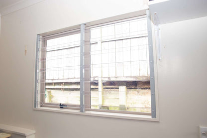 Clear Guard transparent window protection installed on residential window