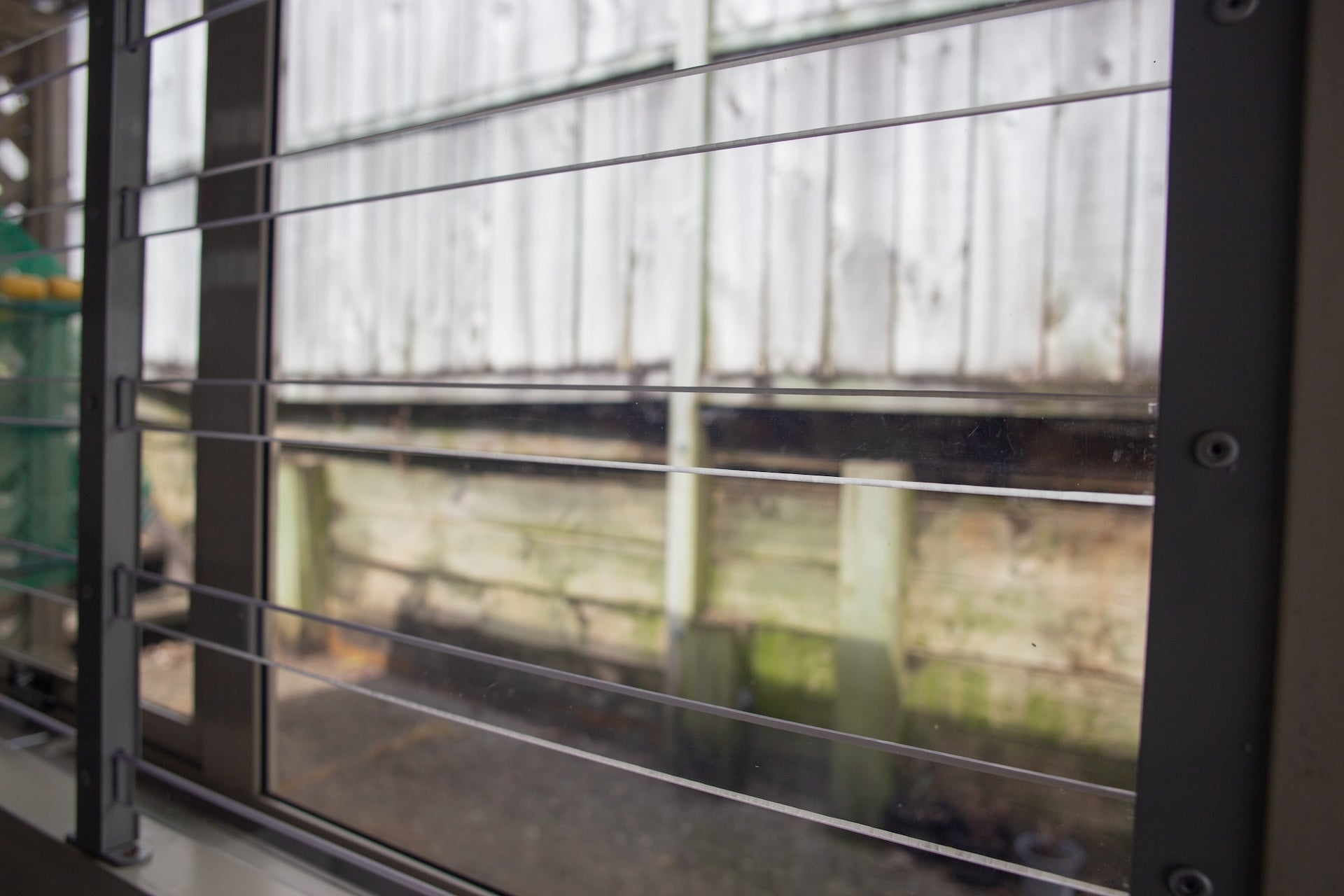 Clear Guard transparent window protection installed on residential window