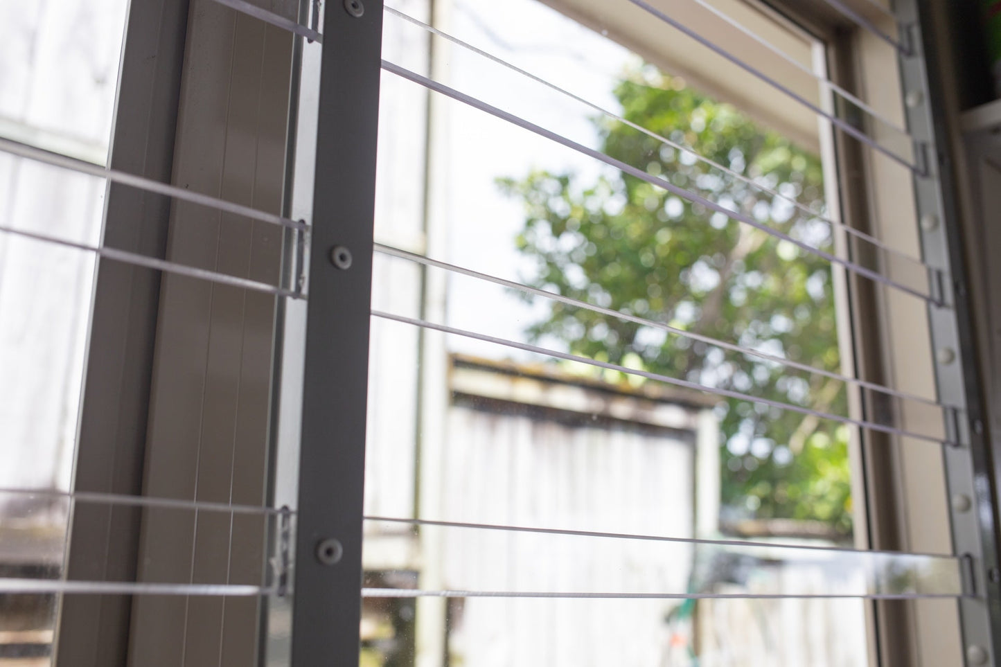 Clear Guard transparent window protection installed on residential window