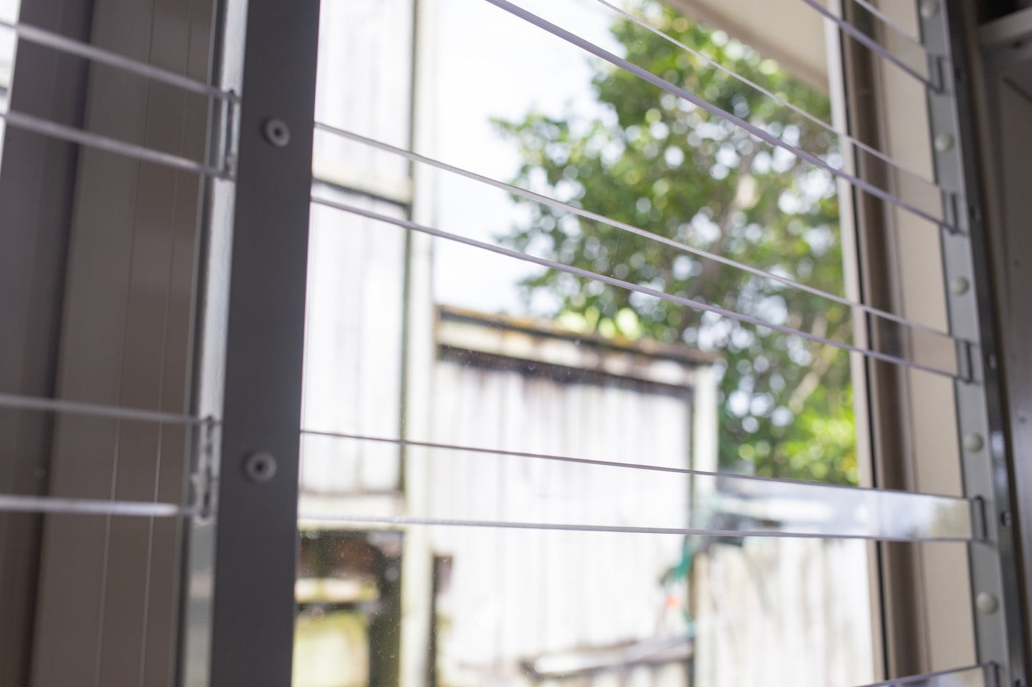 Clear Guard transparent window protection installed on residential window