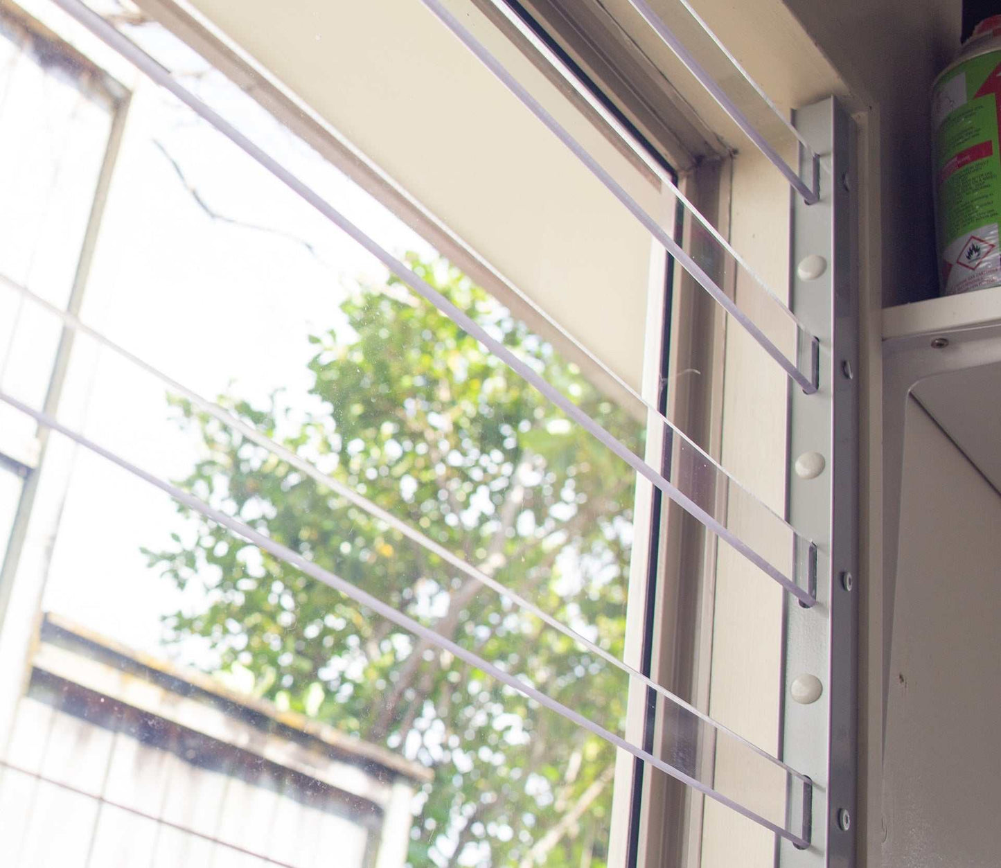 Clear Guard transparent window protection installed on residential window