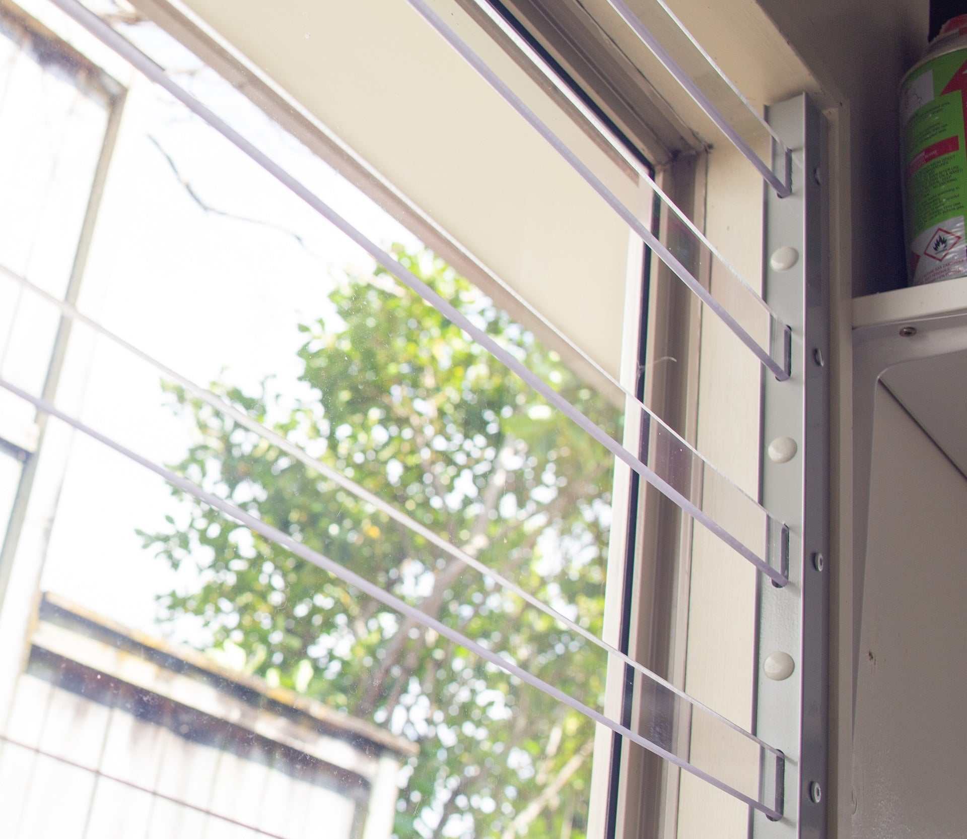 Clear Guard transparent window protection installed on residential window