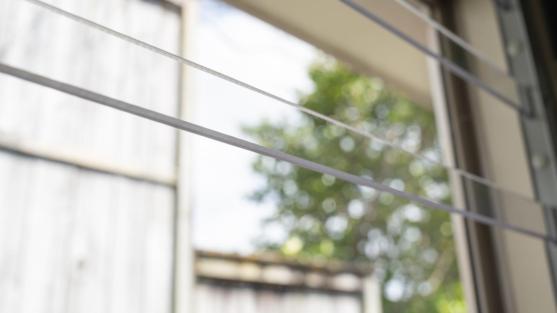 Clear Guard transparent window protection installed on residential window
