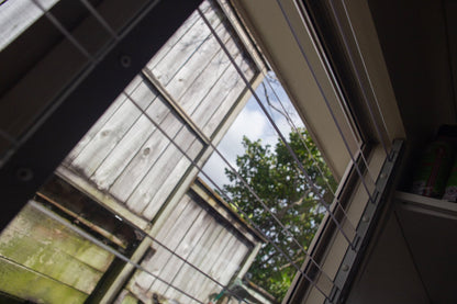 Clear Guard transparent window protection installed on residential window