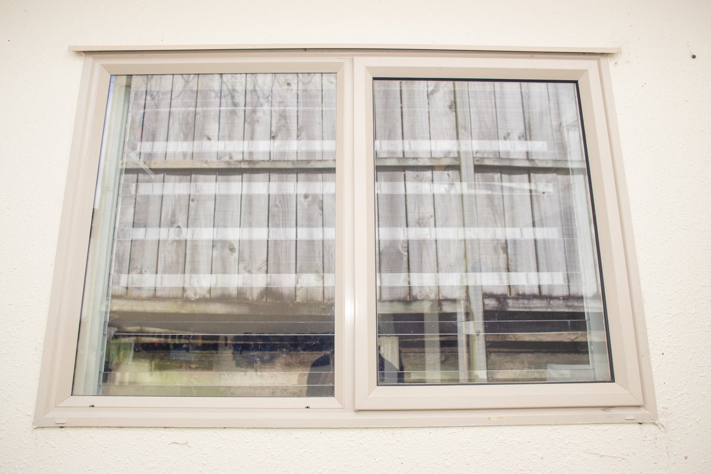 Clear Guard transparent window protection installed on residential window