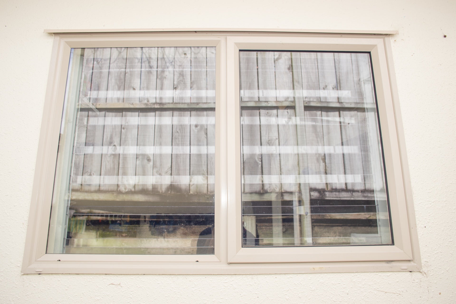 Clear Guard transparent window protection installed on residential window