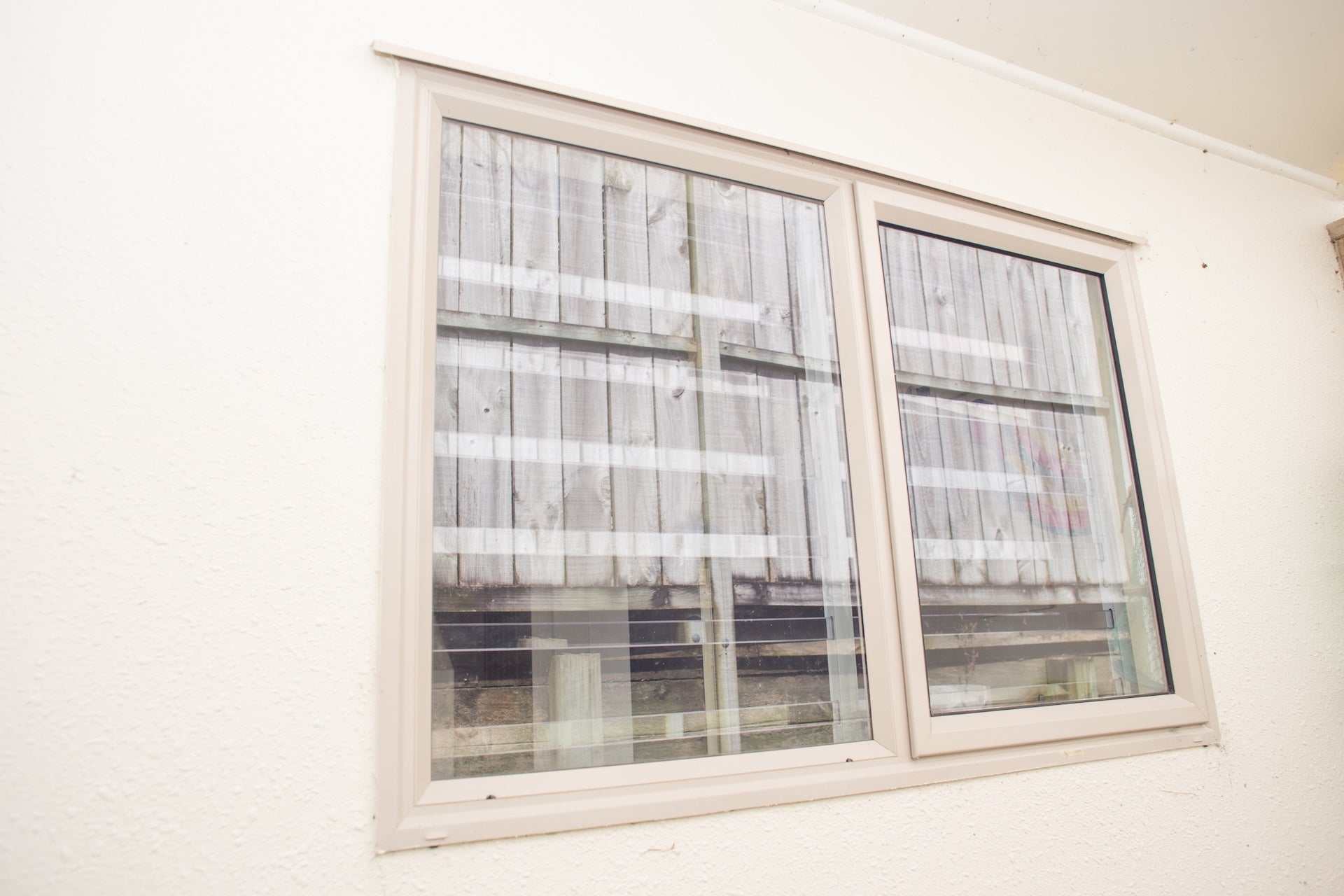 Clear Guard transparent window protection installed on residential window