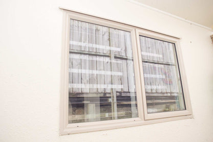 Clear Guard transparent window protection installed on residential window