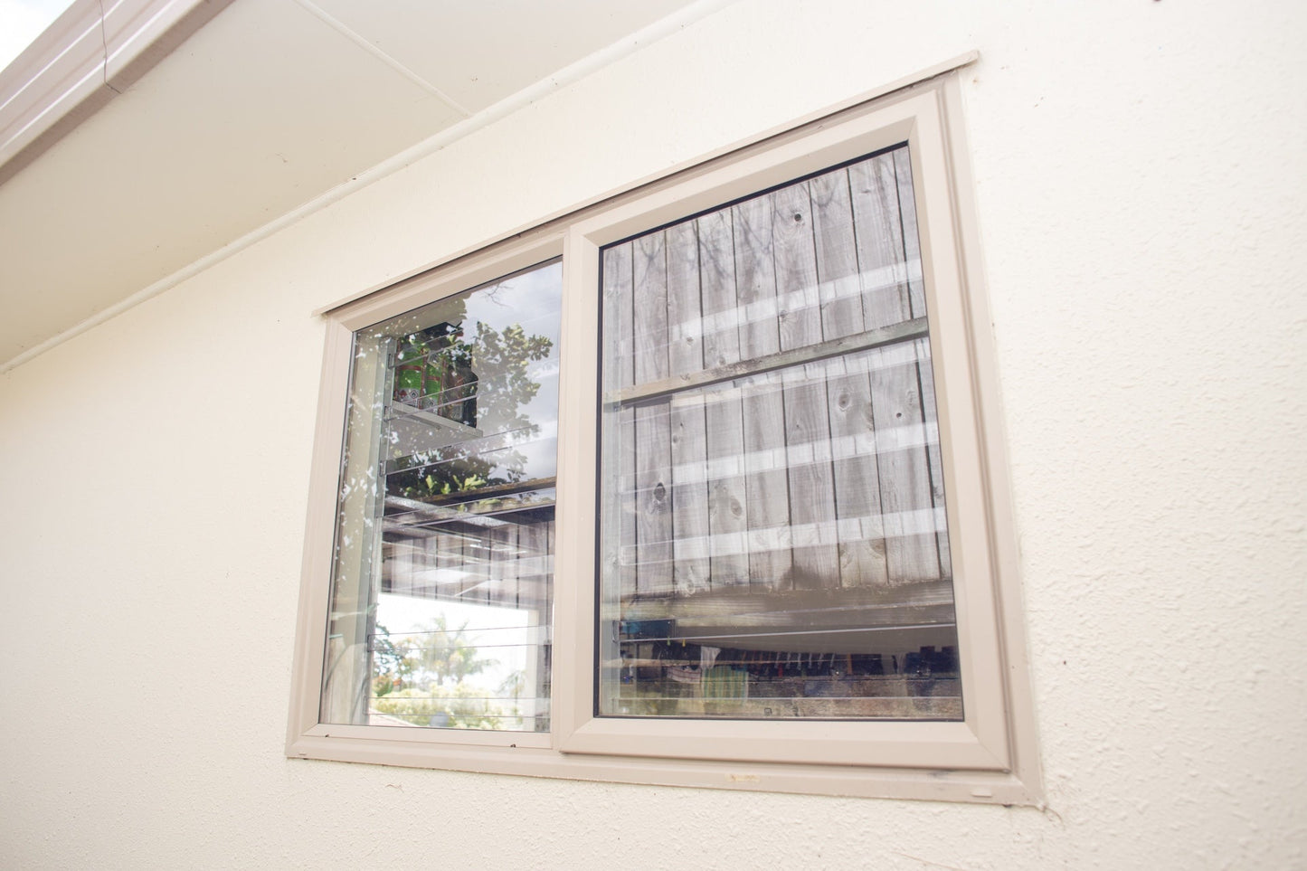Clear Guard transparent window protection installed on residential window