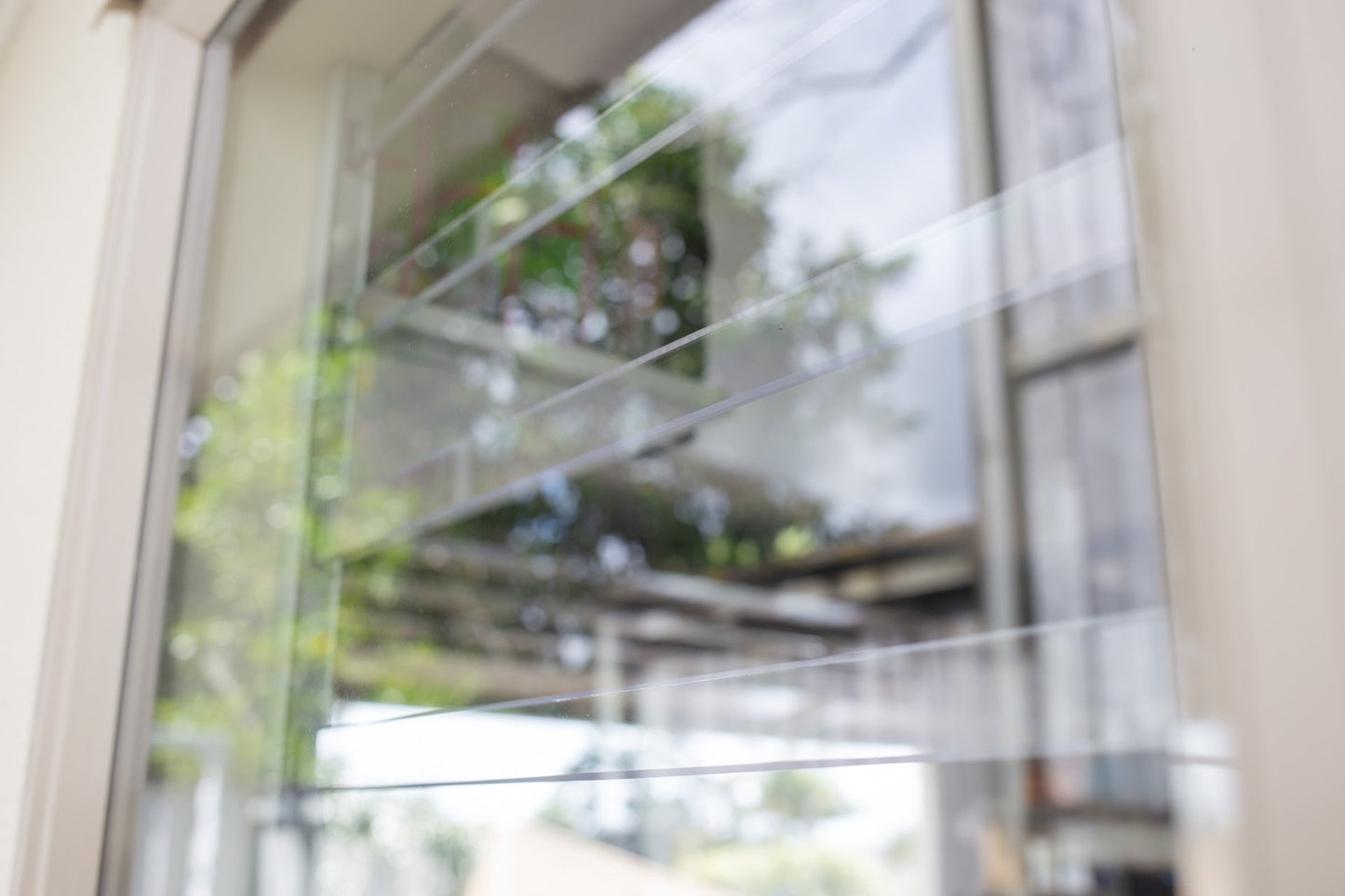 Clear Guard transparent window protection installed on residential window
