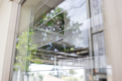 Clear Guard transparent window protection installed on residential window