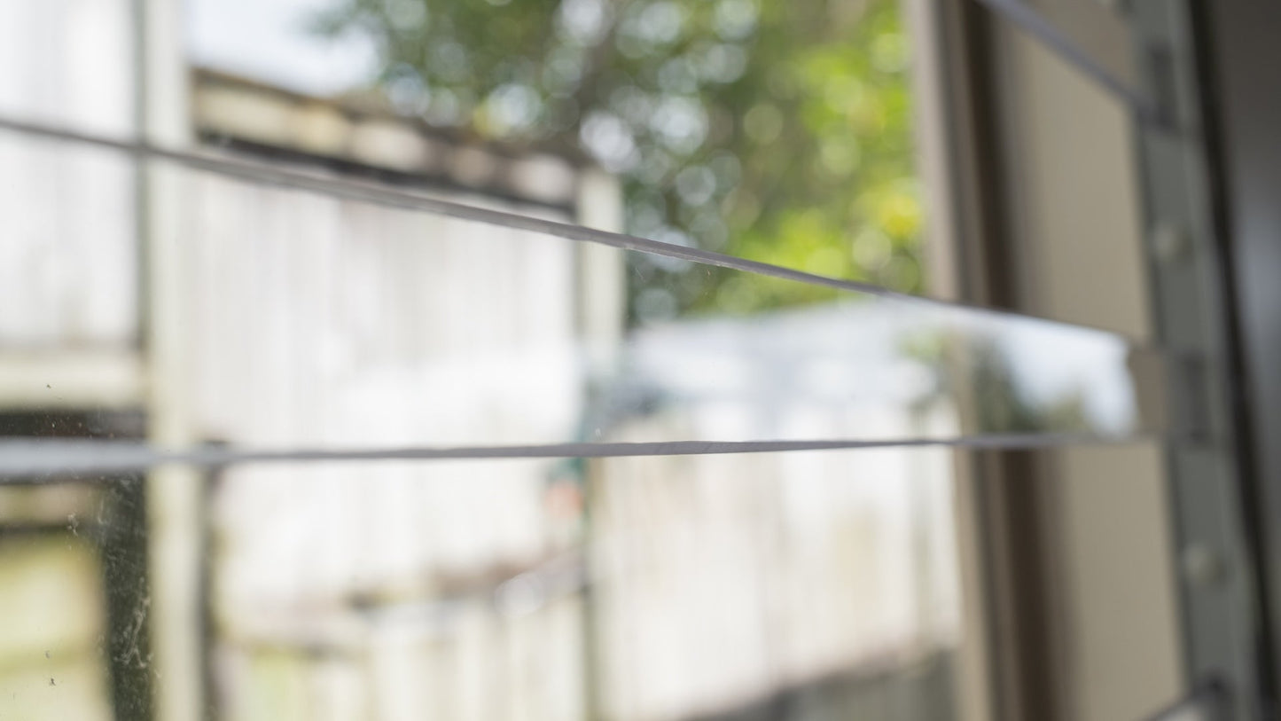 Clear Guard transparent window protection installed on residential window