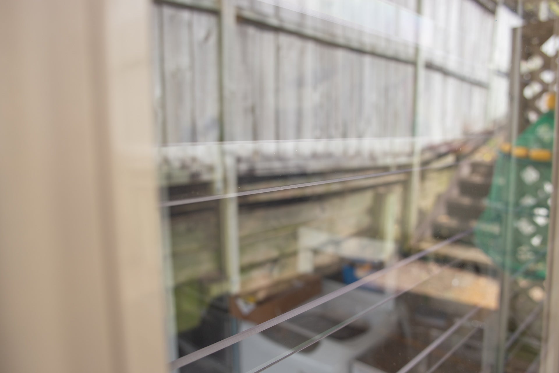 Clear Guard transparent window protection installed on residential window